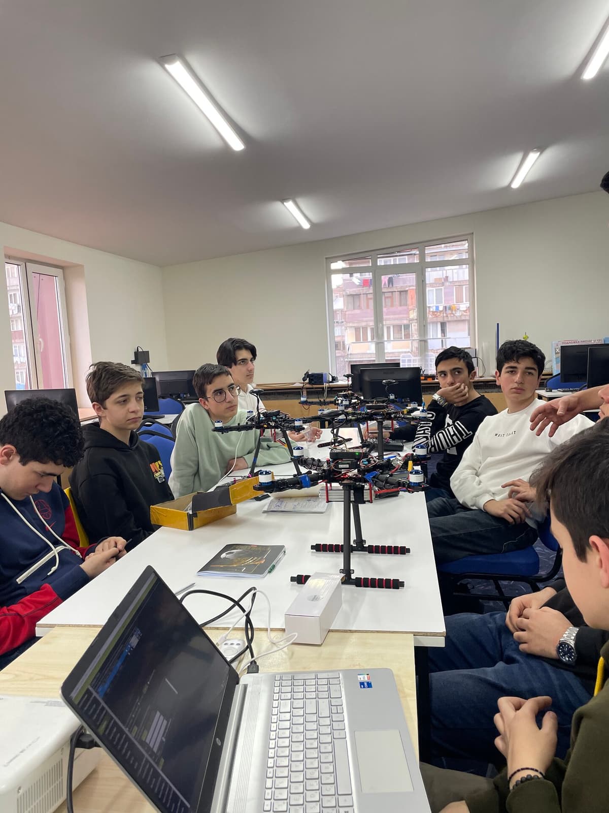 Students and instructor in the Engineering Lab at PhysMath School